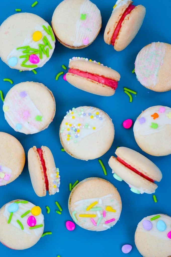 easter decorated macarons on blue pan