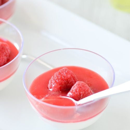 Limoncello Panna Cotta in bowl with raspberry sauce