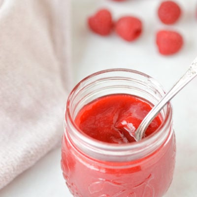 raspberry coulis in jar with spoo