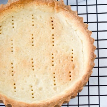 baked pate sucree tart on cooling rack