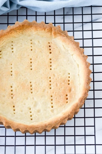 baked pate sucree tart on cooling rack