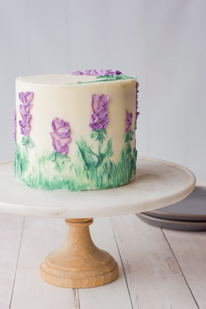 purple flowers painted on cake