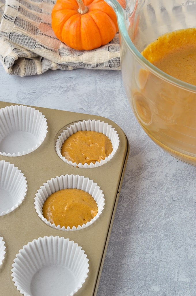 pumpkin spice cupcakes unbaked in cupcake tins