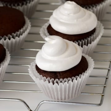 marshmallow frosting piped on cupcakes