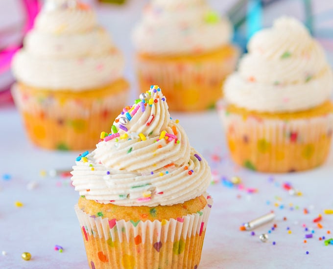 cake batter frosting on cupcakes with sprinkles