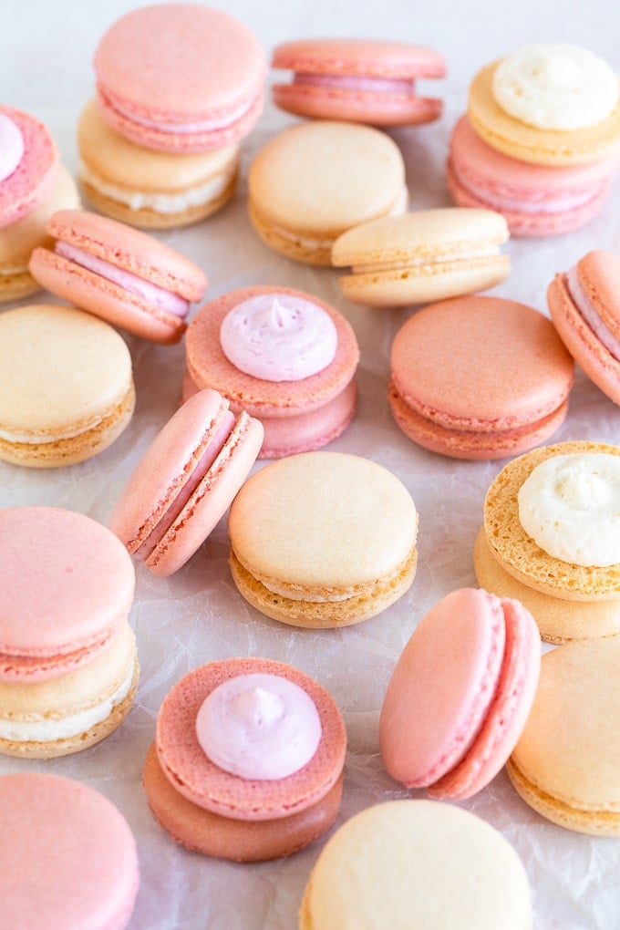 pink and white macarons on parchment 