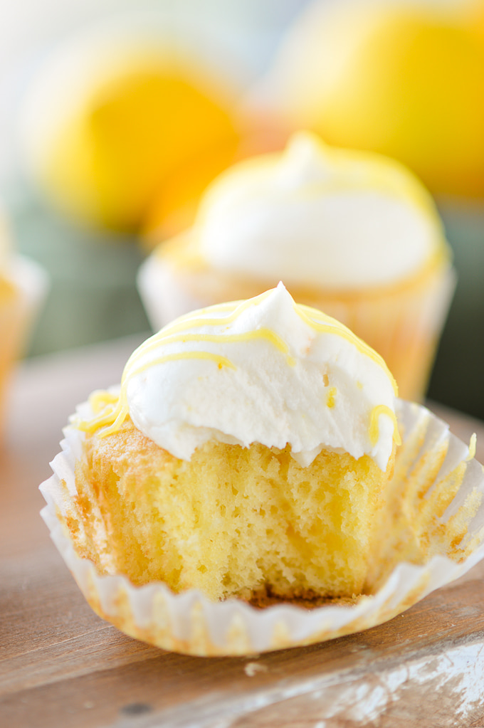 lemon frosting on cupcake with bite out of it