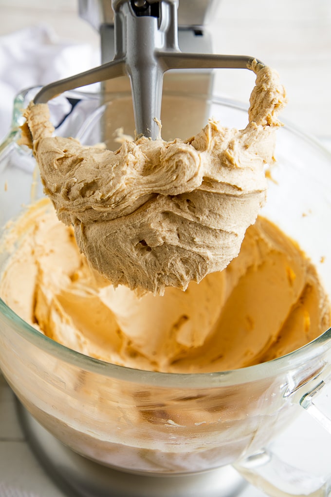 close up of peanut butter frosting on beater 