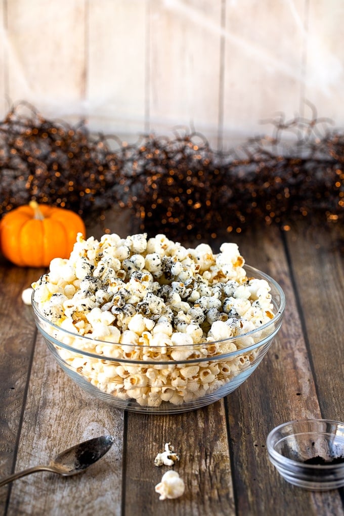 popcorn in bowl with activated charcoal on top