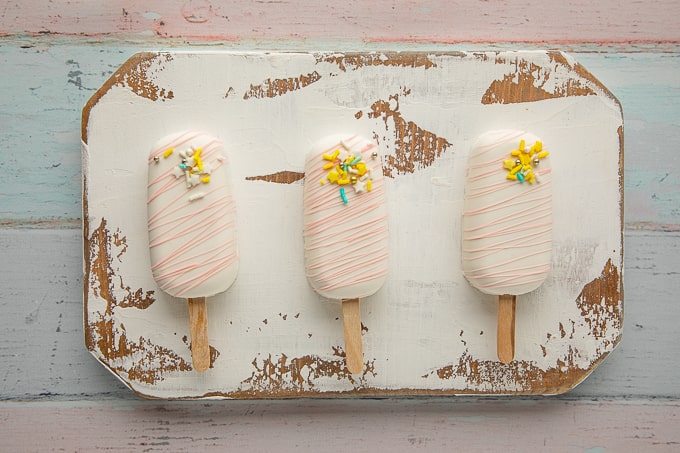 3 cakesicles on wooden board