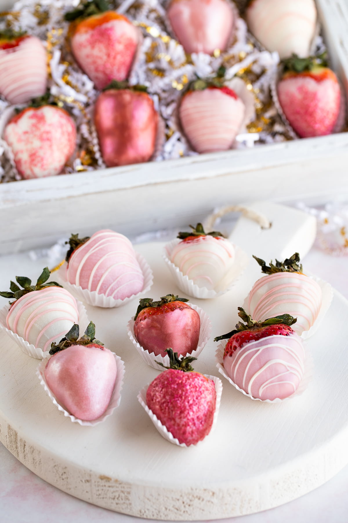 pink and white chocolate covered strawberries up close.