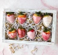 pink and white valentine's day chocolate covered strawberries in box.