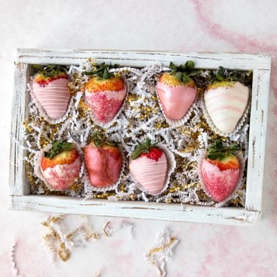 pink and white valentine's day chocolate covered strawberries in box.