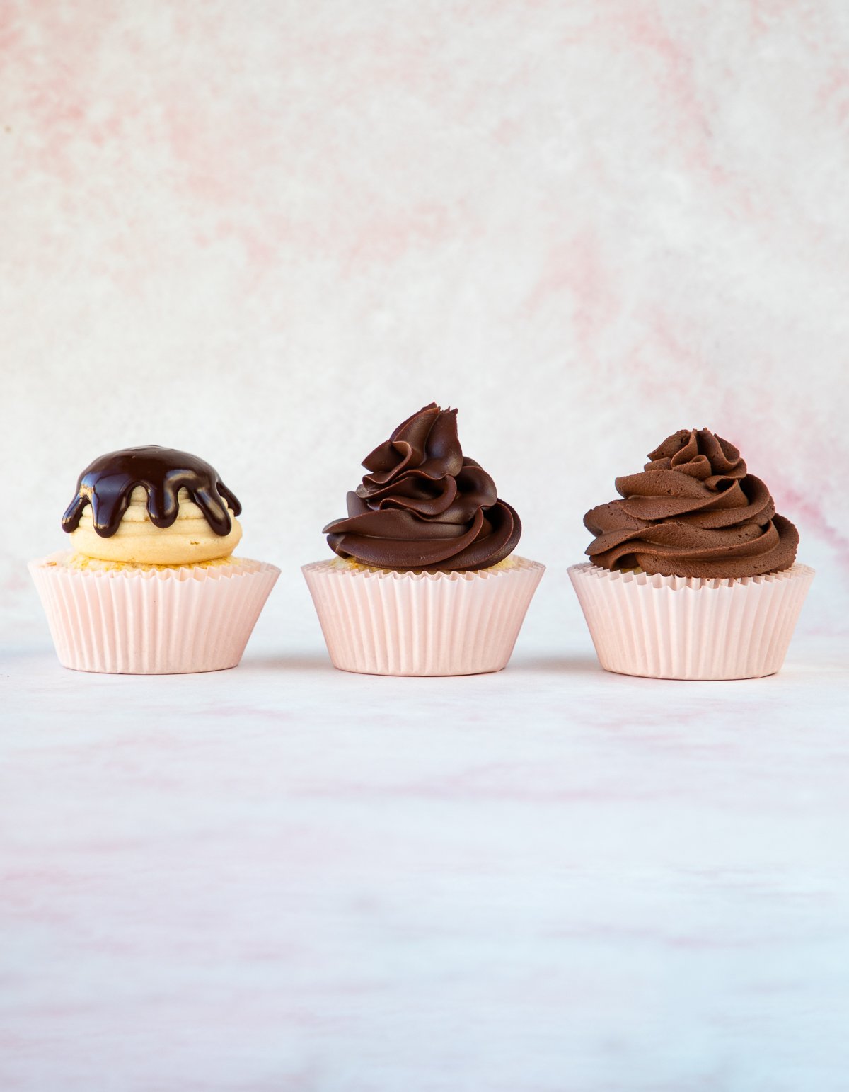 close up of warm, cooled, and whipped ganache on cupcakes