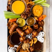 pretzel board with cheese sauce, mustard, and chocoalte