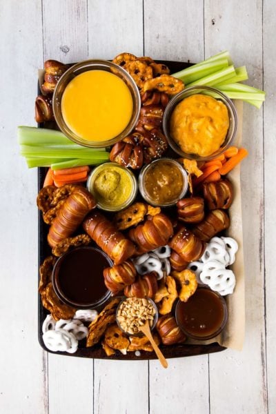 pretzel board with cheese sauce, mustard, and chocoalte