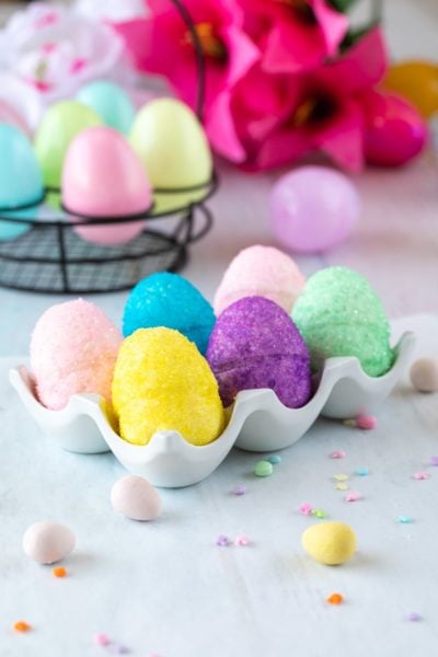 marshmallow easter eggs with sanding sugar in porcelain egg holder