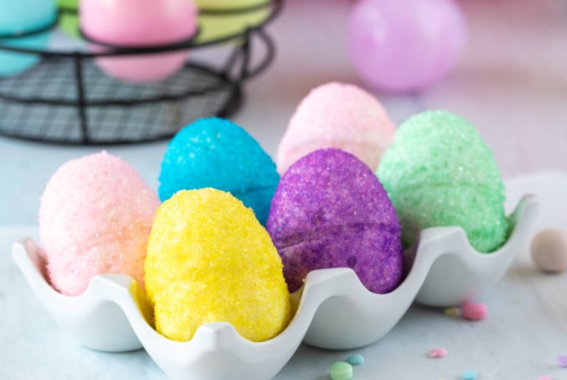marshmallow easter eggs with sanding sugar in porcelain egg holder