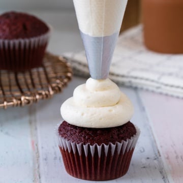 Ermine frosting piped on cupcake