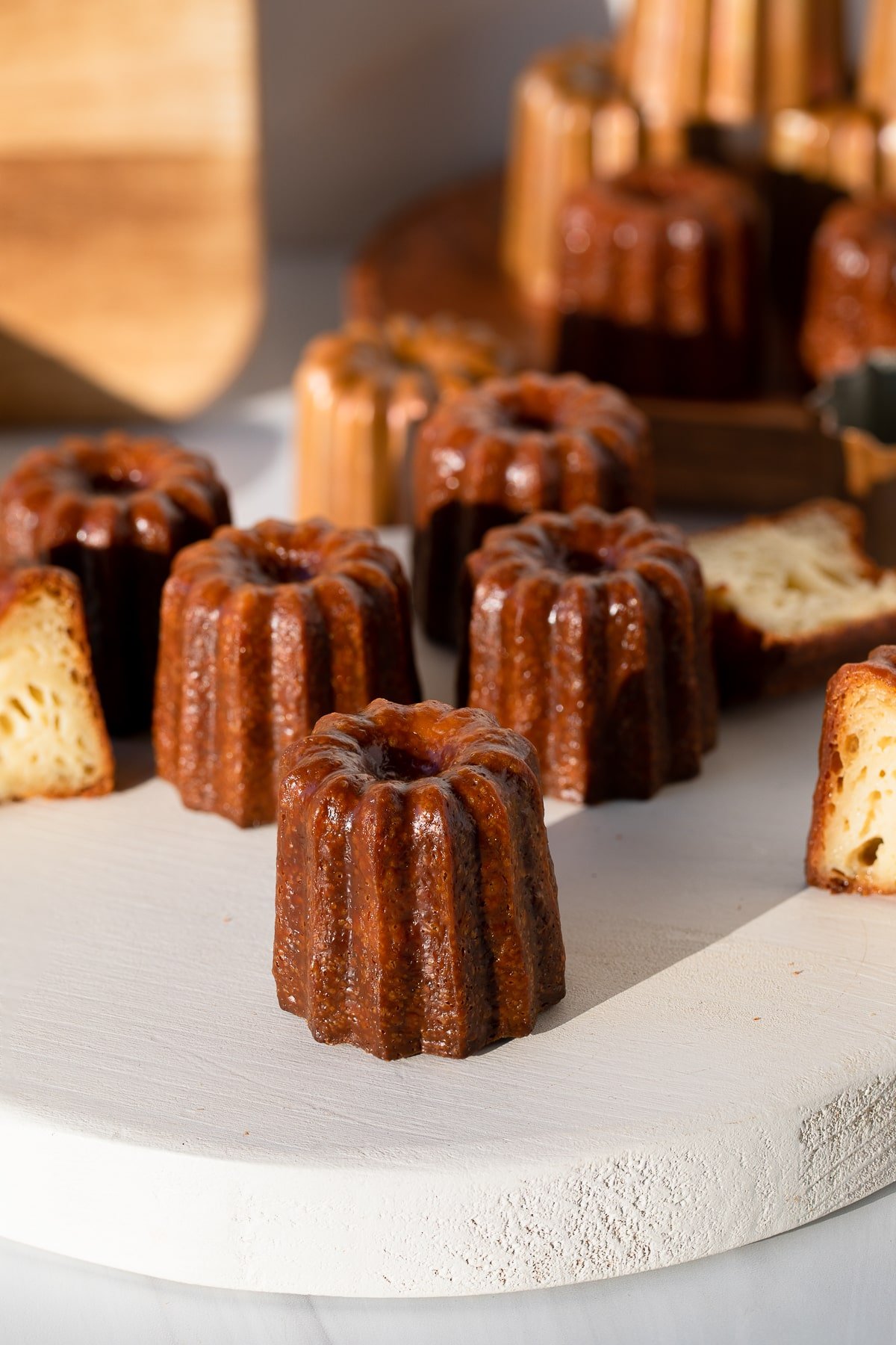 french caneles on wooden board