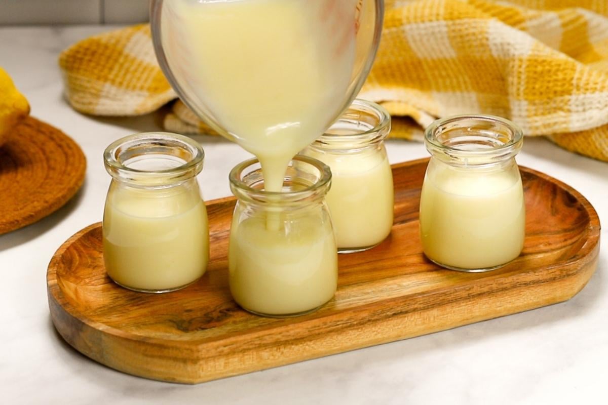 pouring lemon posset into containers