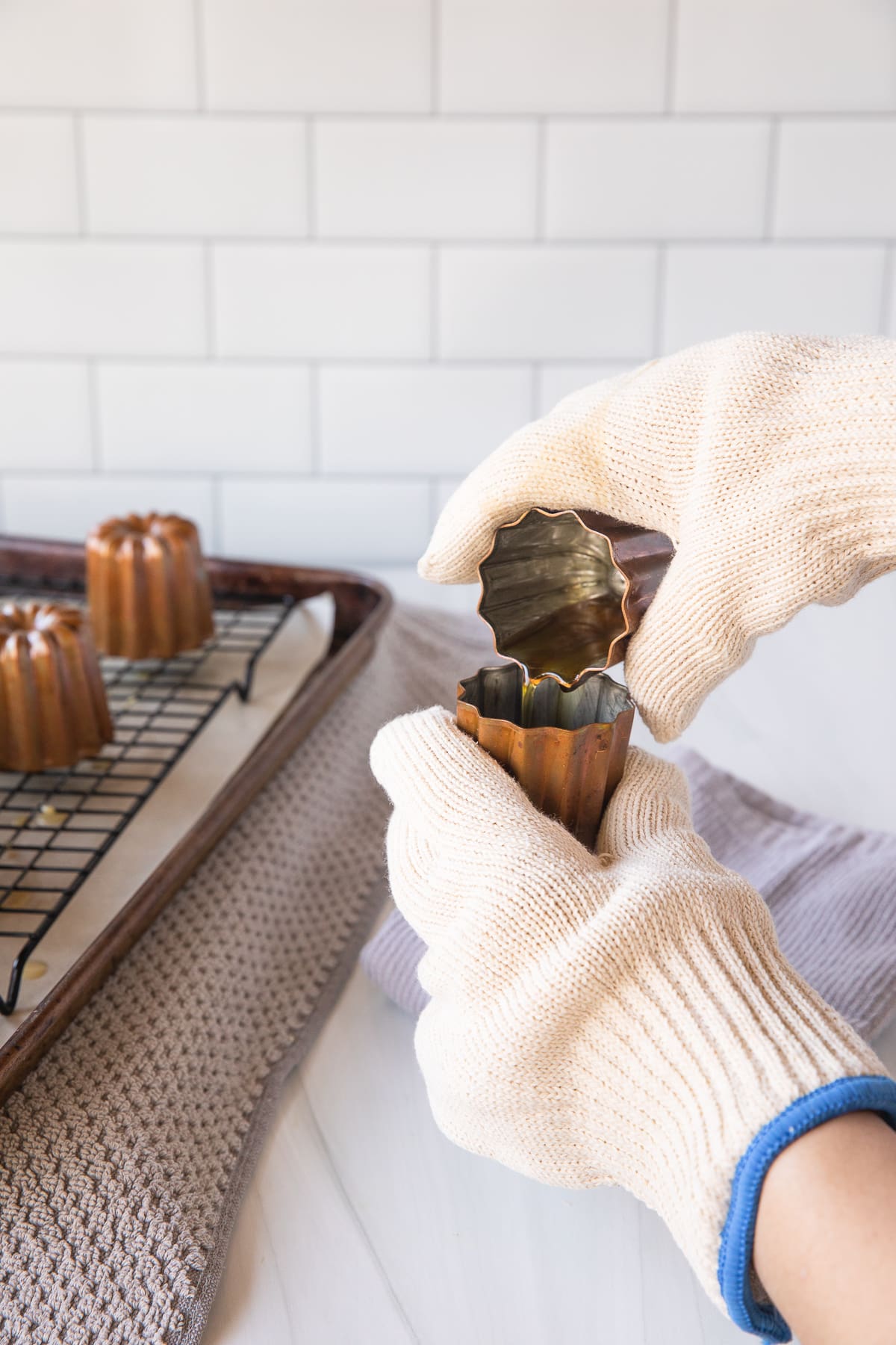 pouring beeswax into canele molds