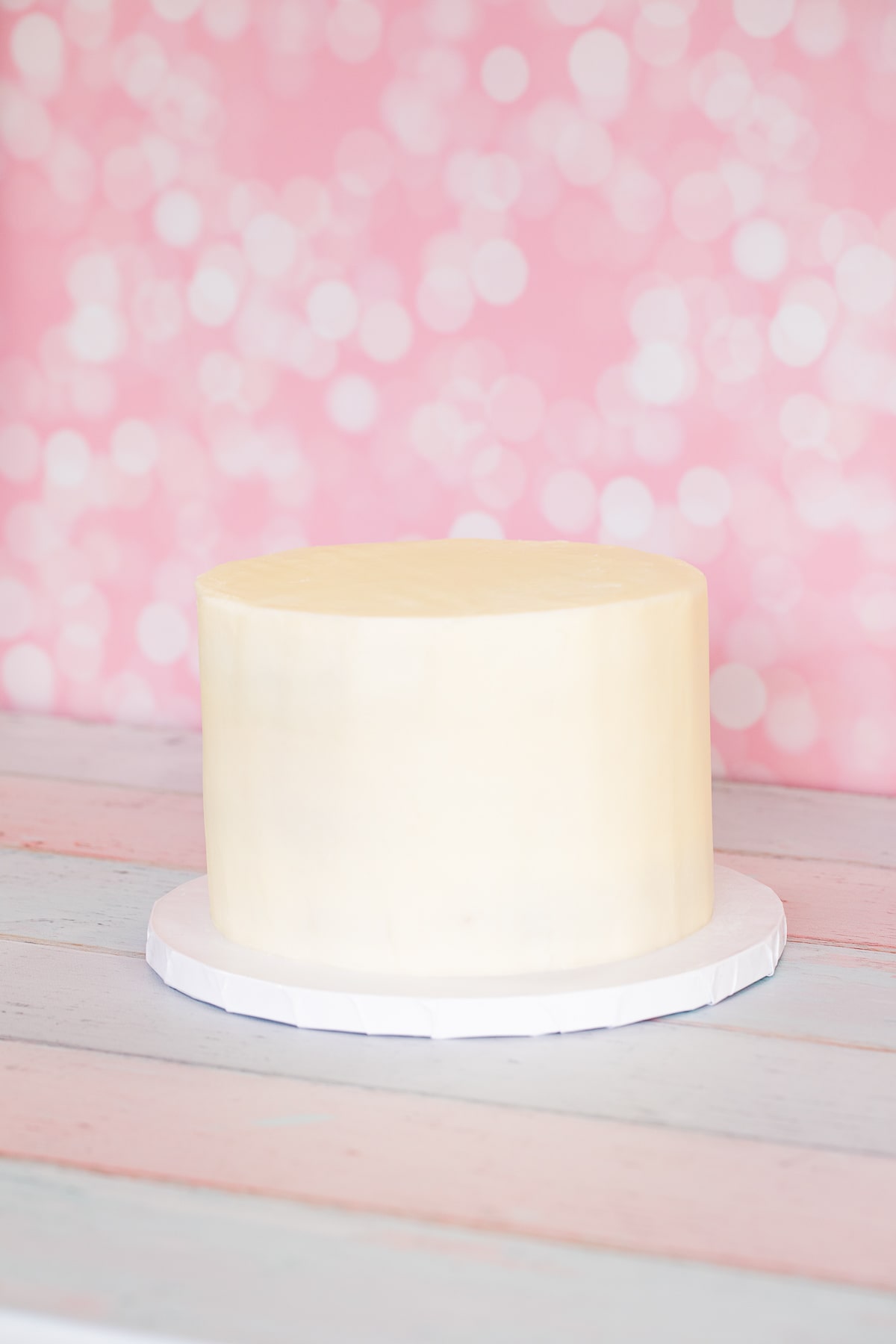 frosted layer cake on cake board