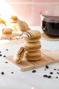 coffee macaron with a bit taken out