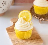 lemon cream cheese frosting on cupcake with lemon slice