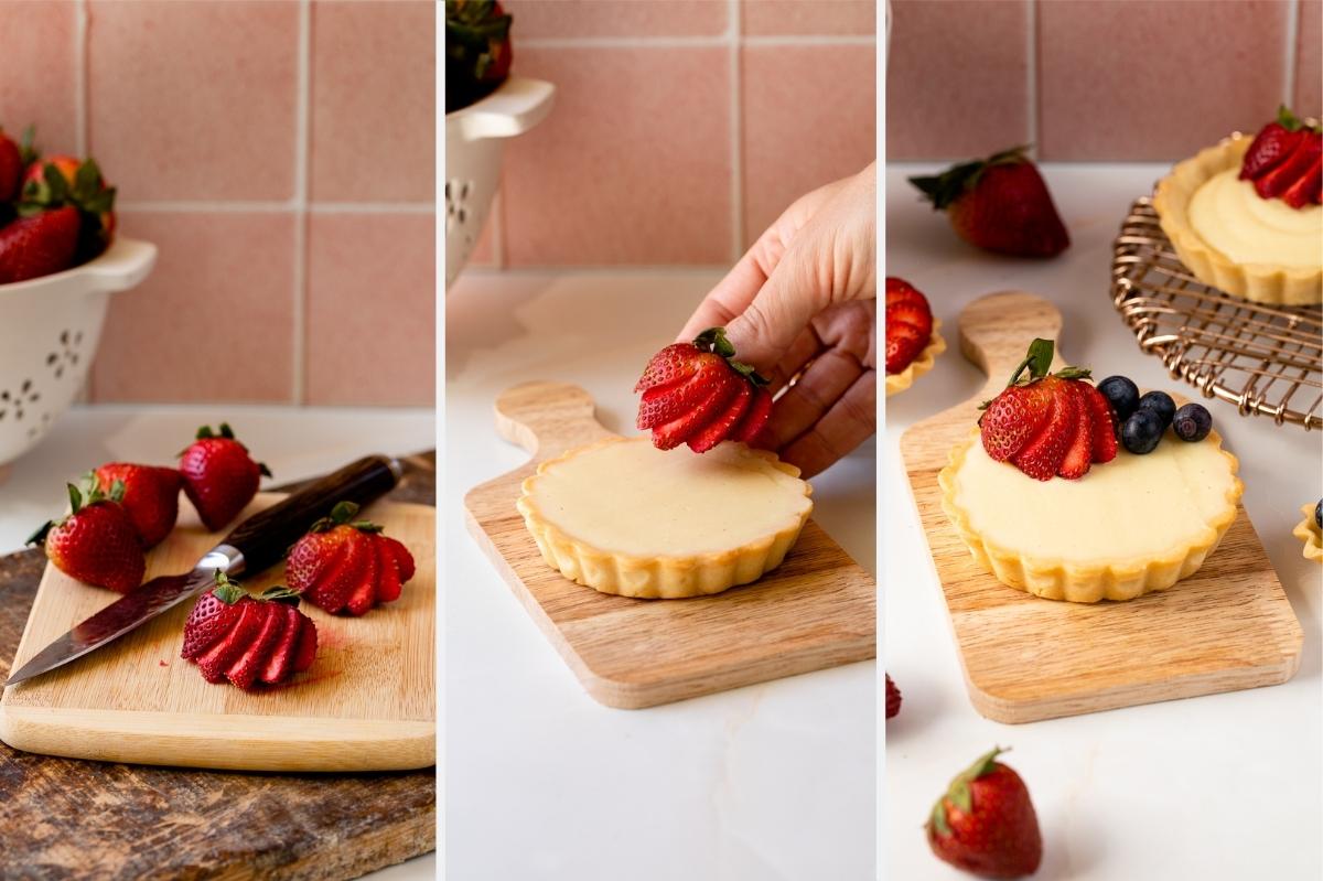adding strawberries to mini fruit tarts.