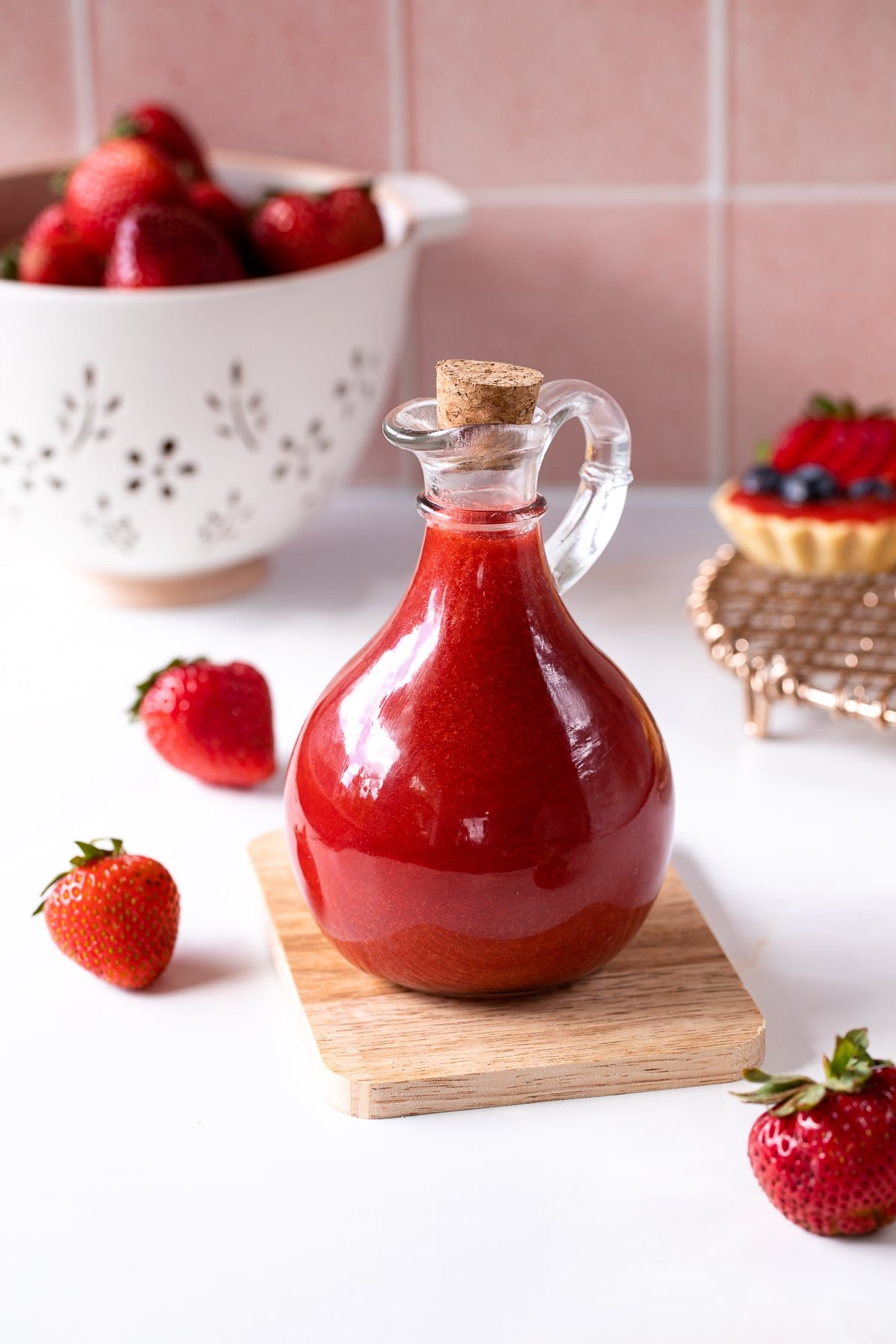 strawberry coulis in glass bottle.
