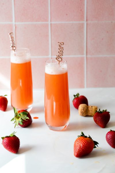 strawberry mimosas in stemless champagne glasses