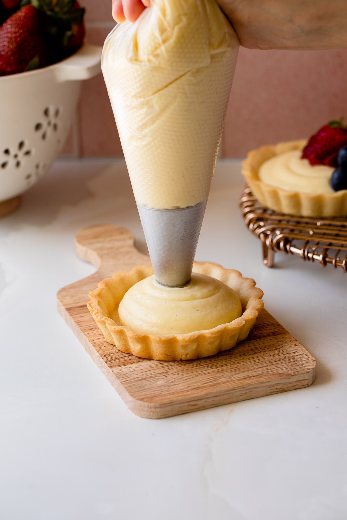 filling tartlet shell with pastry cream