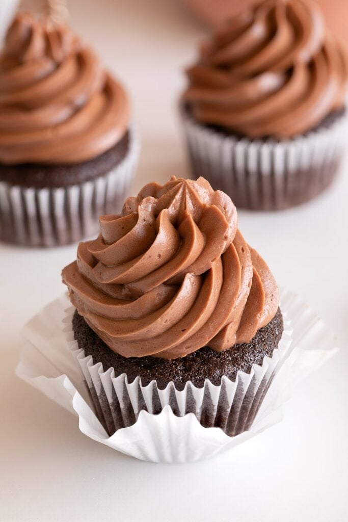chocolate swiss meringue buttercream on cupcake up close.