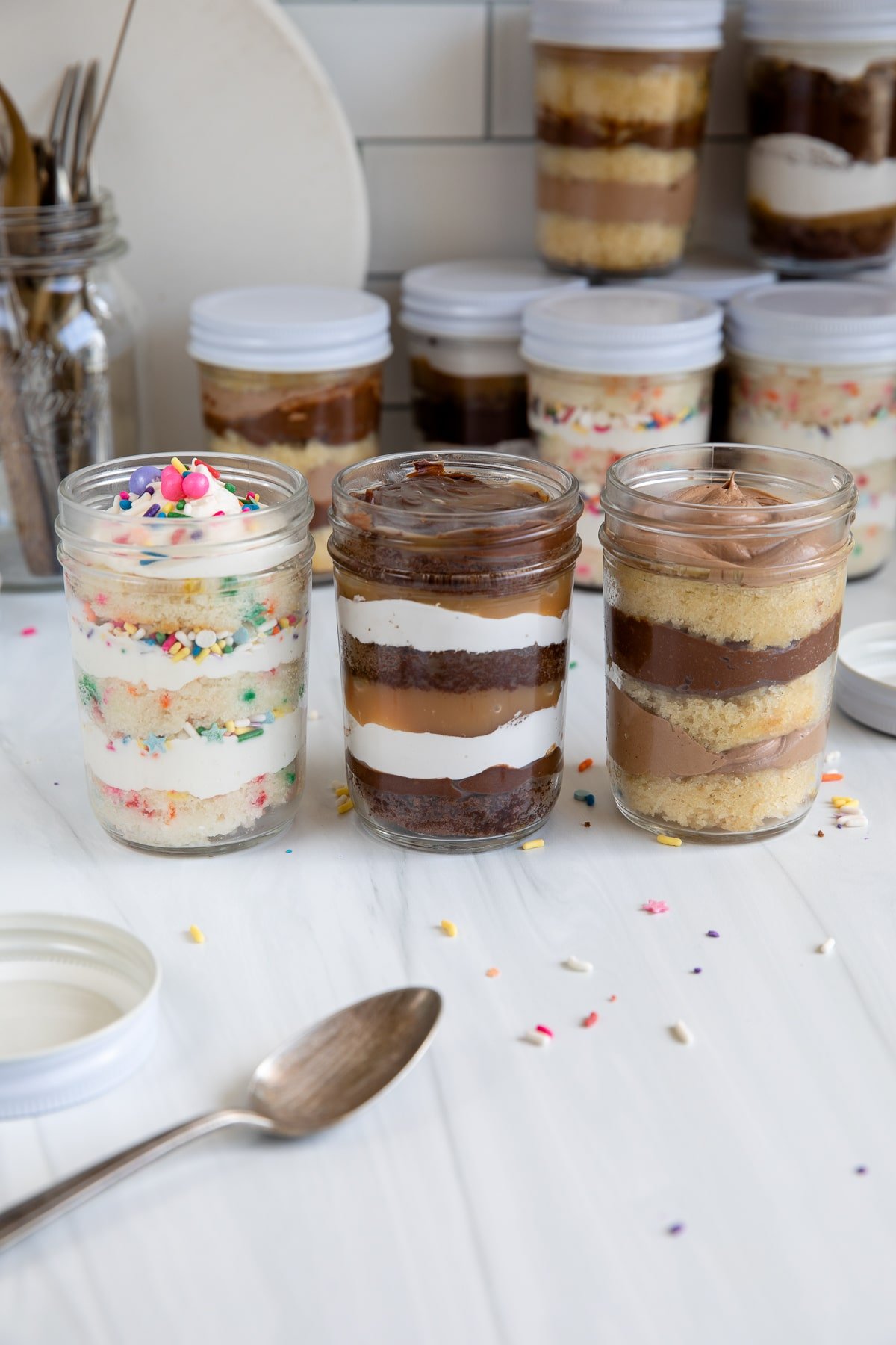 3 flavors of jar cakes in a row.