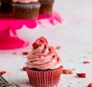 strawberry frosting on cupcake.