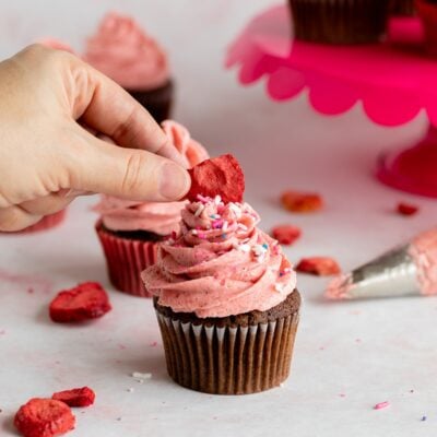 strawberry frosting on cupcake.