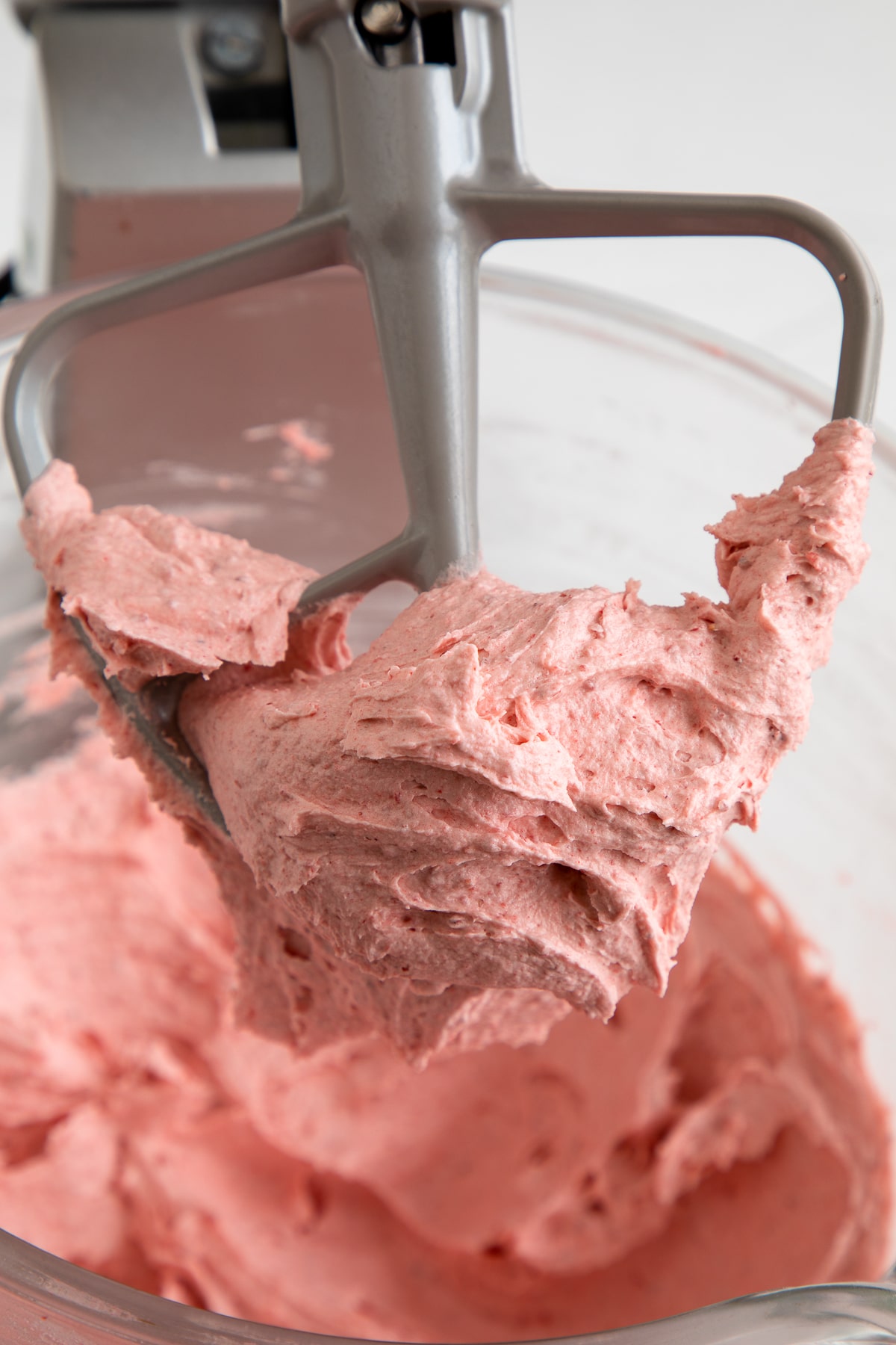 strawberry buttercream frosting on beater.
