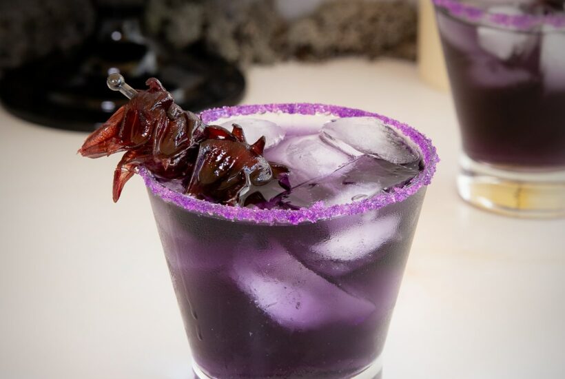 purple people eater cocktail with purple sugar rim.