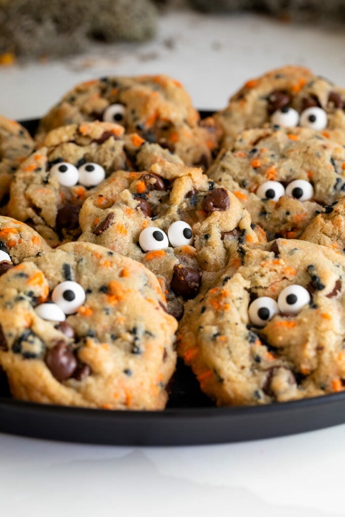 halloween chocolate chip cookies up close with a bite taken out.