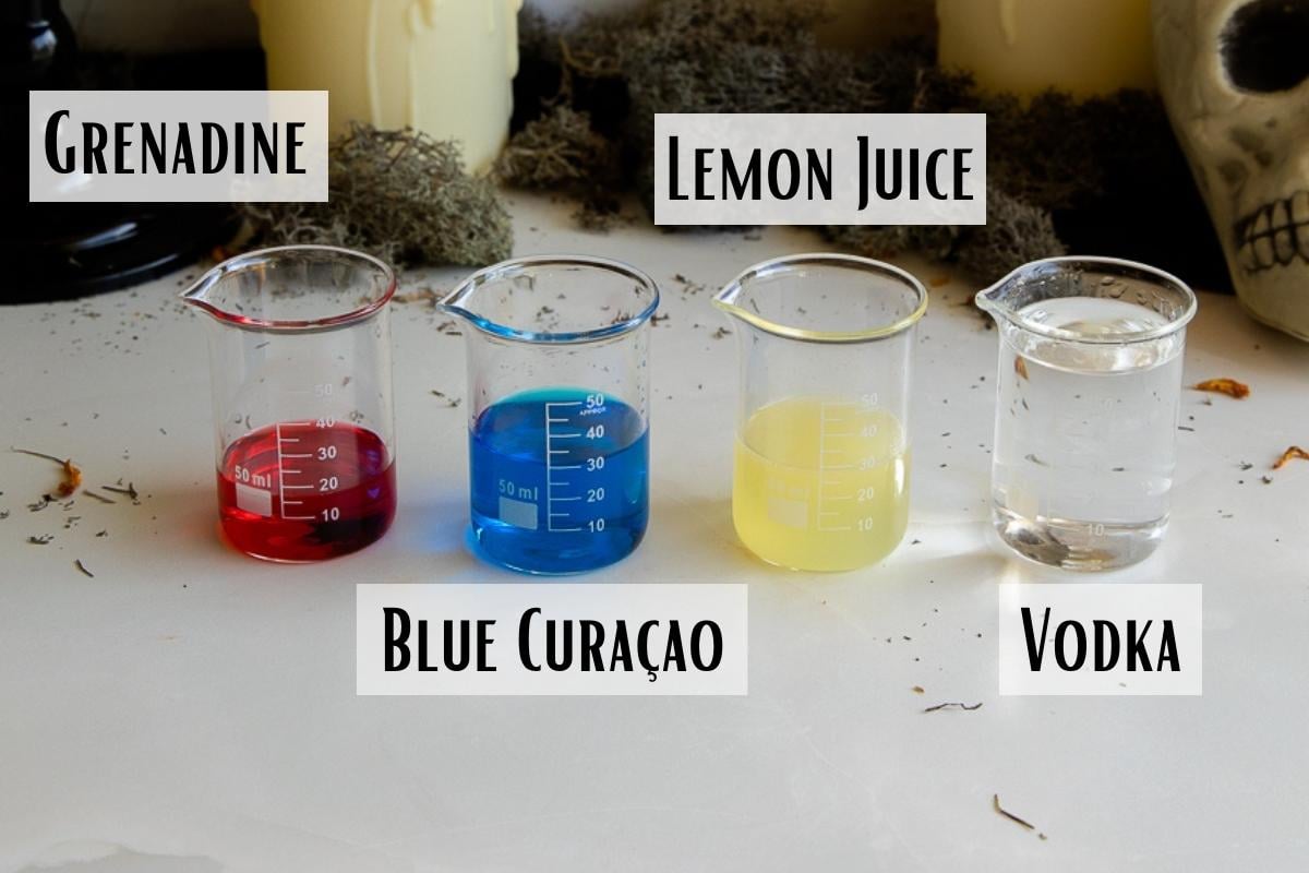 purple people eater drink ingredients of vodka, grenadine, blue curacao, lemon juice, and grenadine.