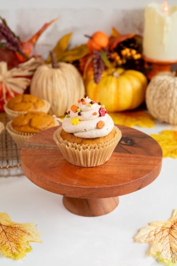 easy pumpkin spice cupcakes with brown sugar frosting and sprinkles up close.