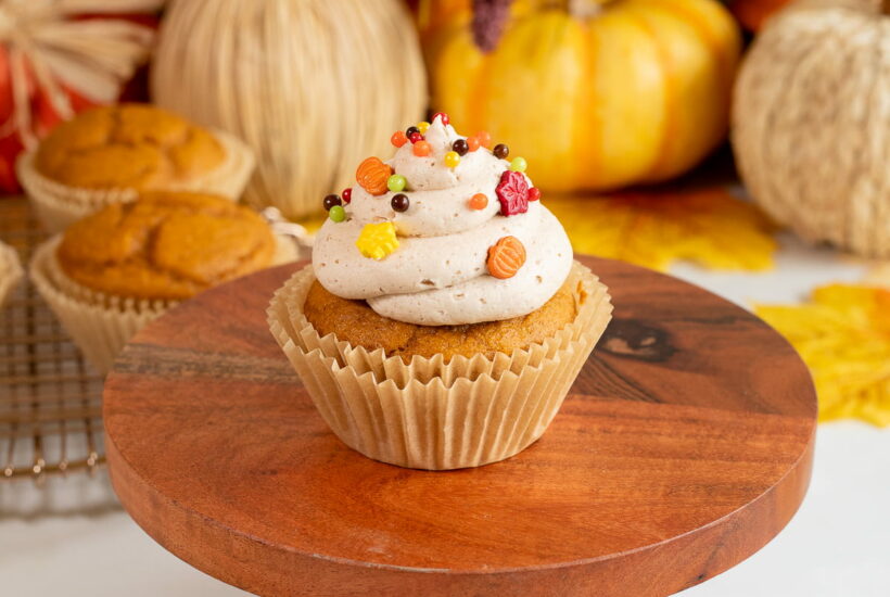 easy pumpkin spice cupcakes with brown sugar frosting and sprinkles up close.