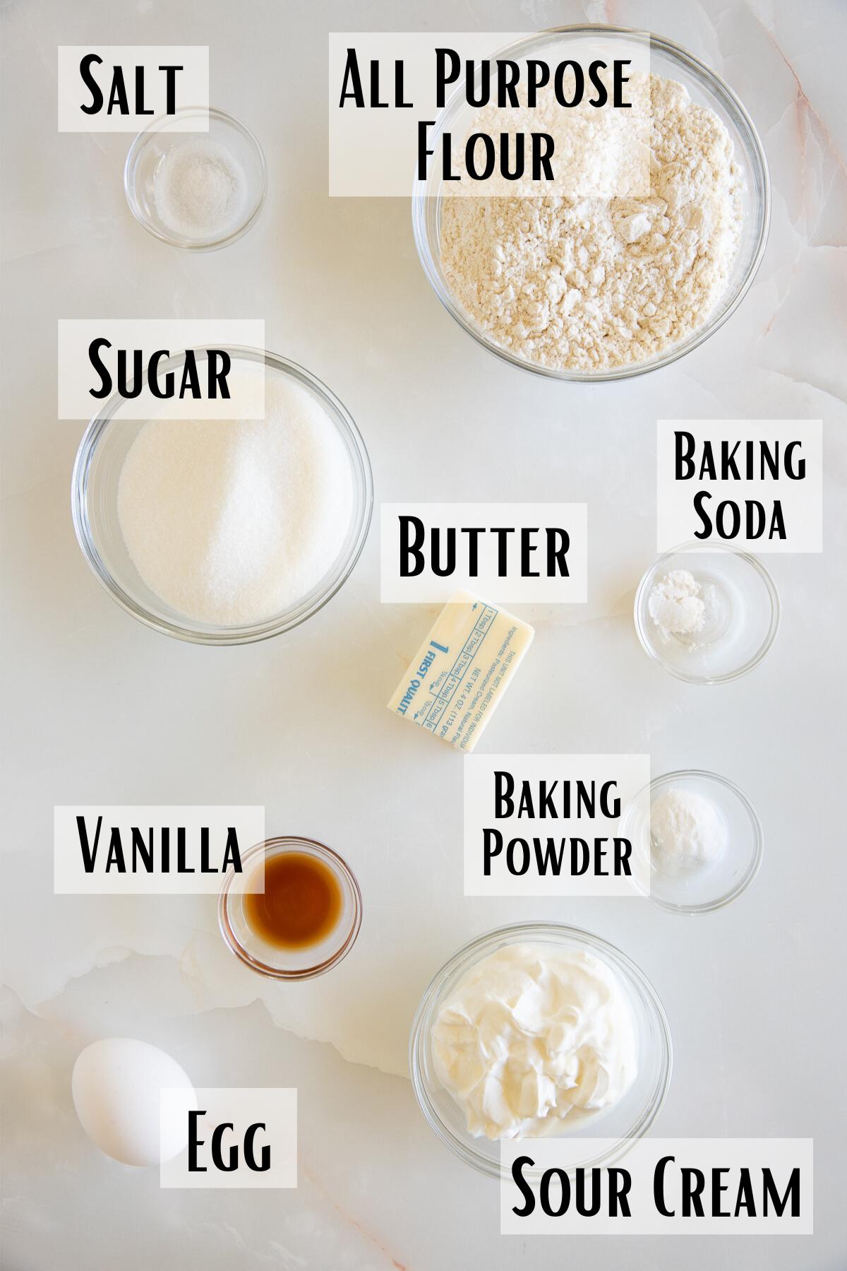 sour cream cookie ingredients of flour, baking powder, baking soda, salt, butter, sugar, vanilla, sour cream and egg.