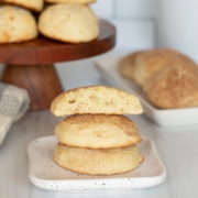 sour cream cookies stacked and cut in half