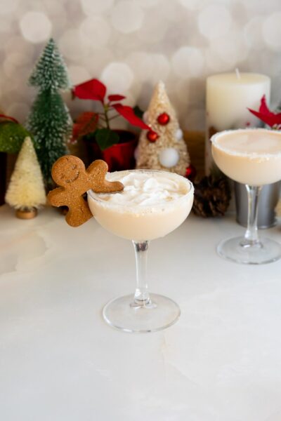 sugar cookie martini in glass with whipped cream and cookie.