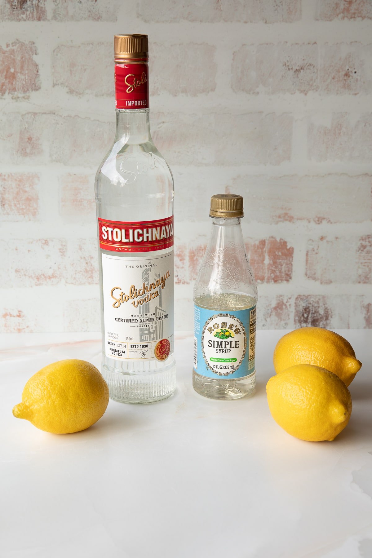 lemon drop shot ingredients of lemons, simple syrup, and vodka.