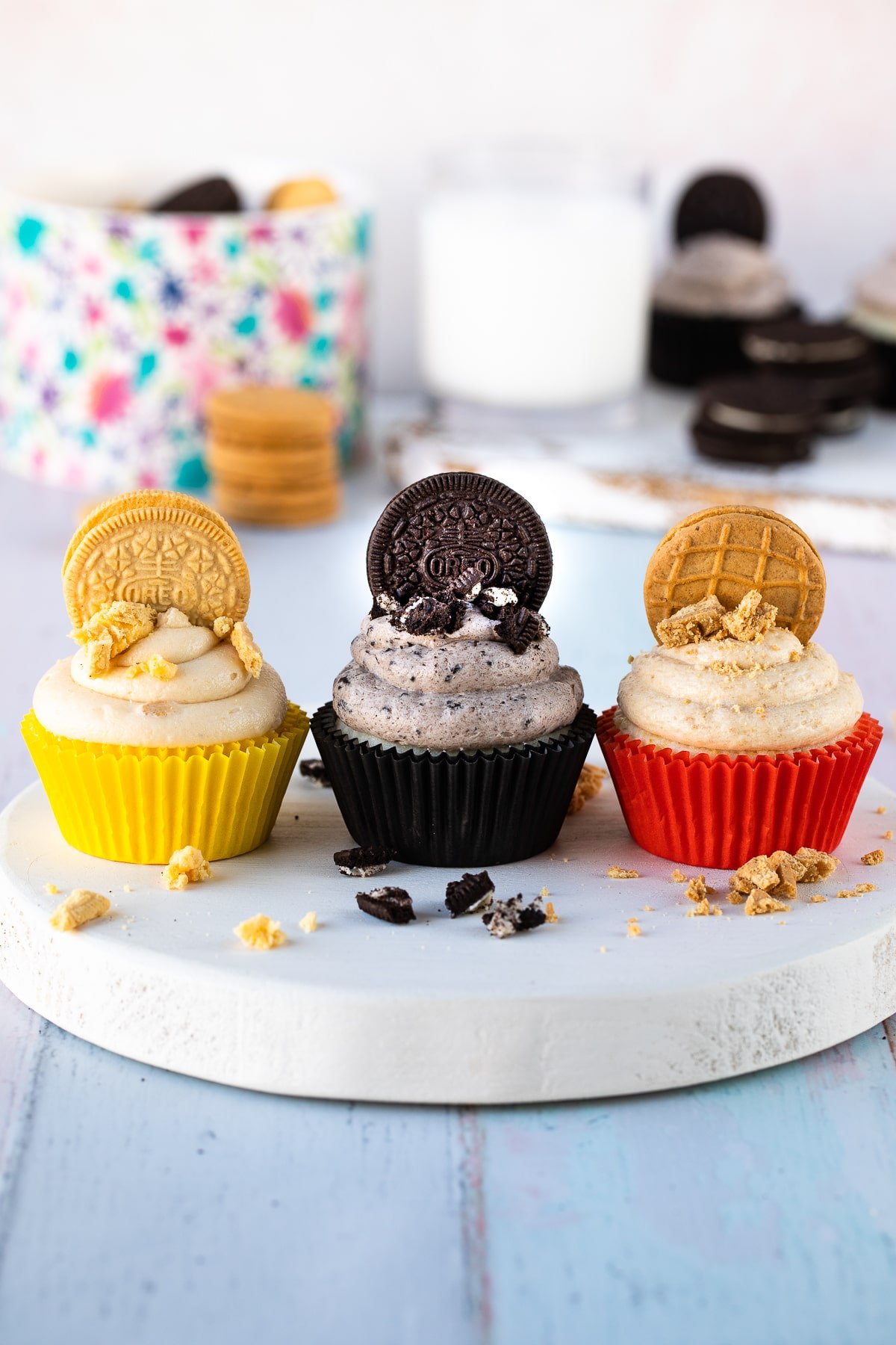 cookies and cream frosting on cupcakes with oreos and nutter butters.