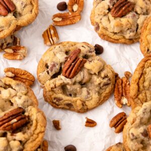 chocolate chip pecan cookies on parchment paper.