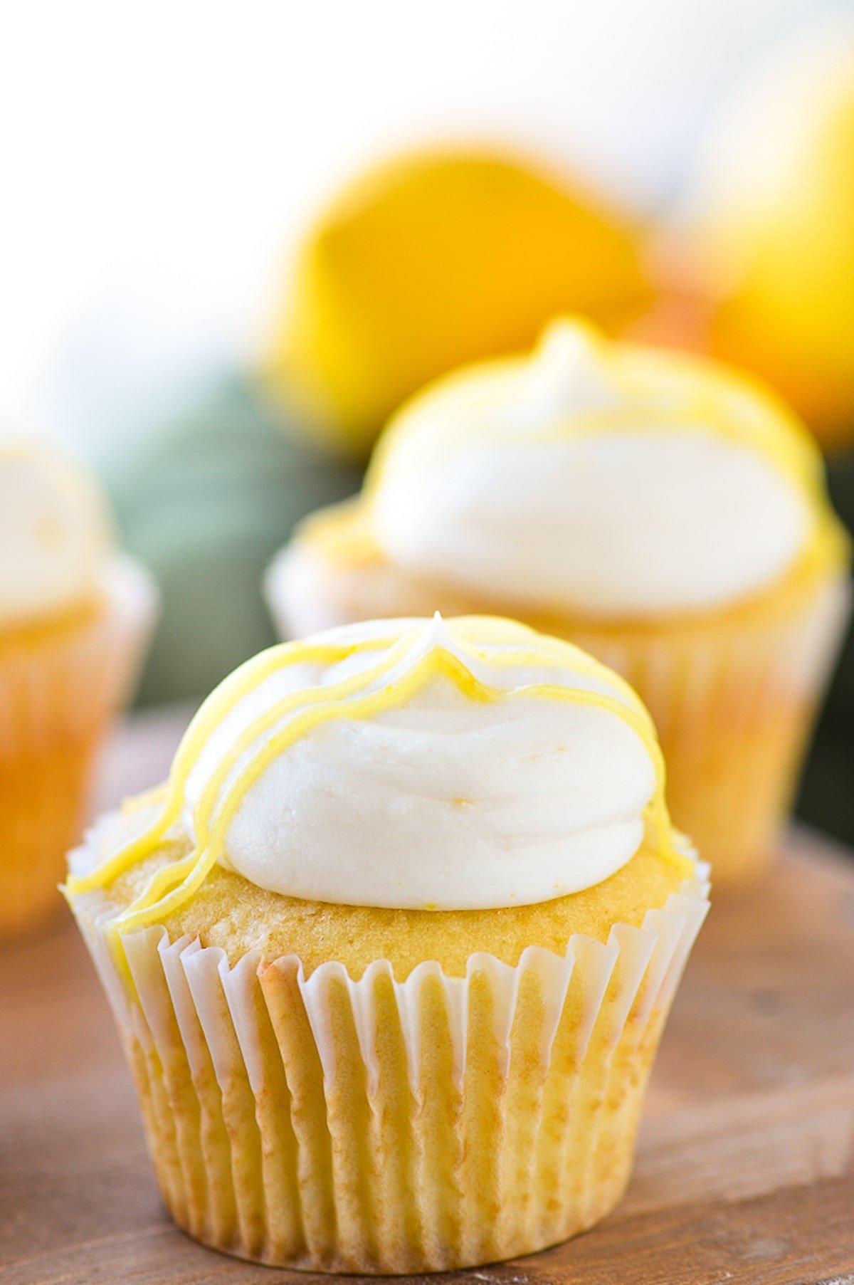 lemon buttercream frosting on yellow cupcake.